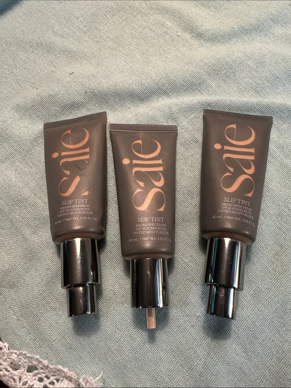 Saie Slip Tint Tinted Moisturizer Trio - Taupe & Rose Gold Accents